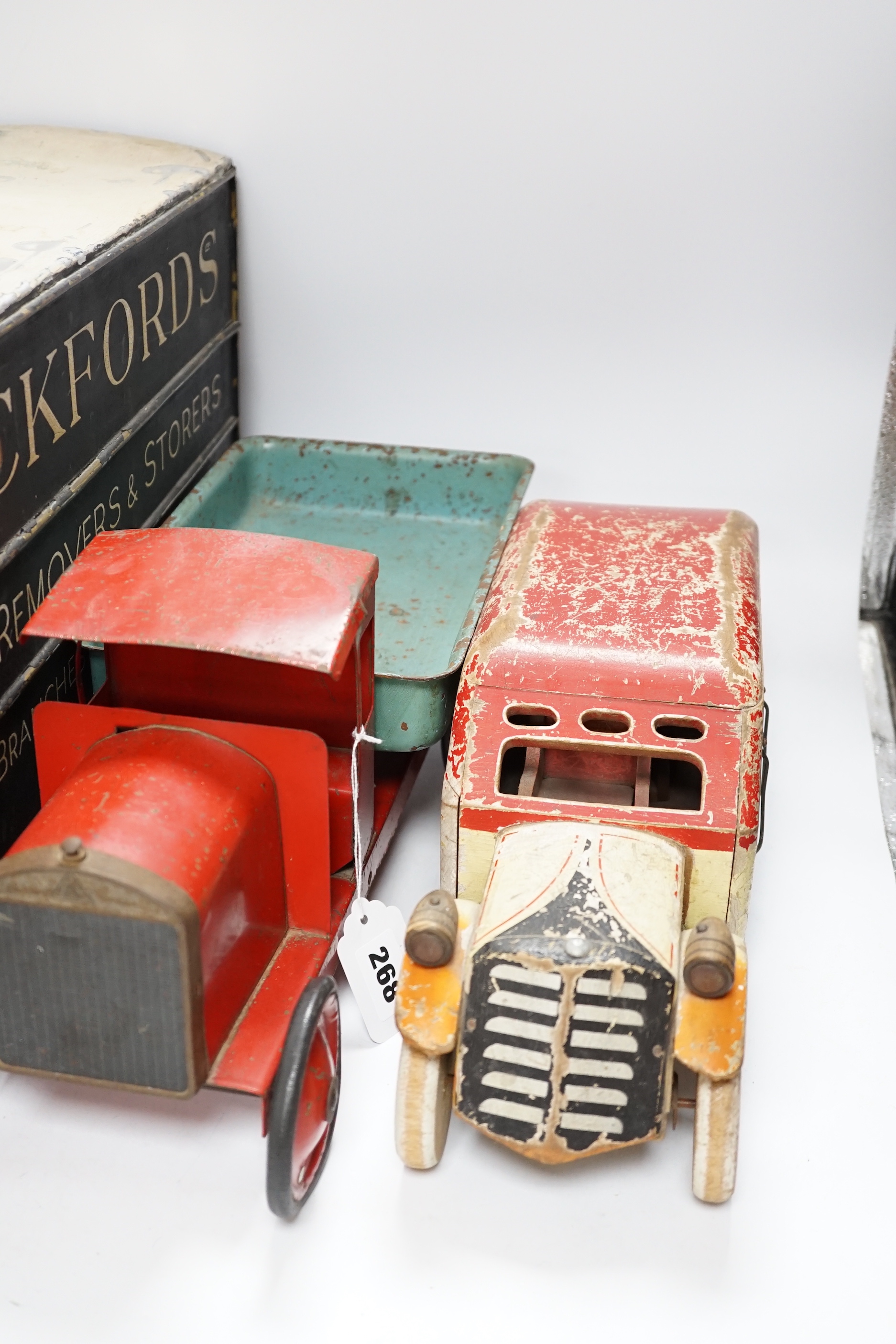 Three model vehicles including; a tinplate Tri-ang tipper lorry, a Pickfords removal van (believed to have been used as a shop window display) and a wooden bus, length of Pickfords van 54cm